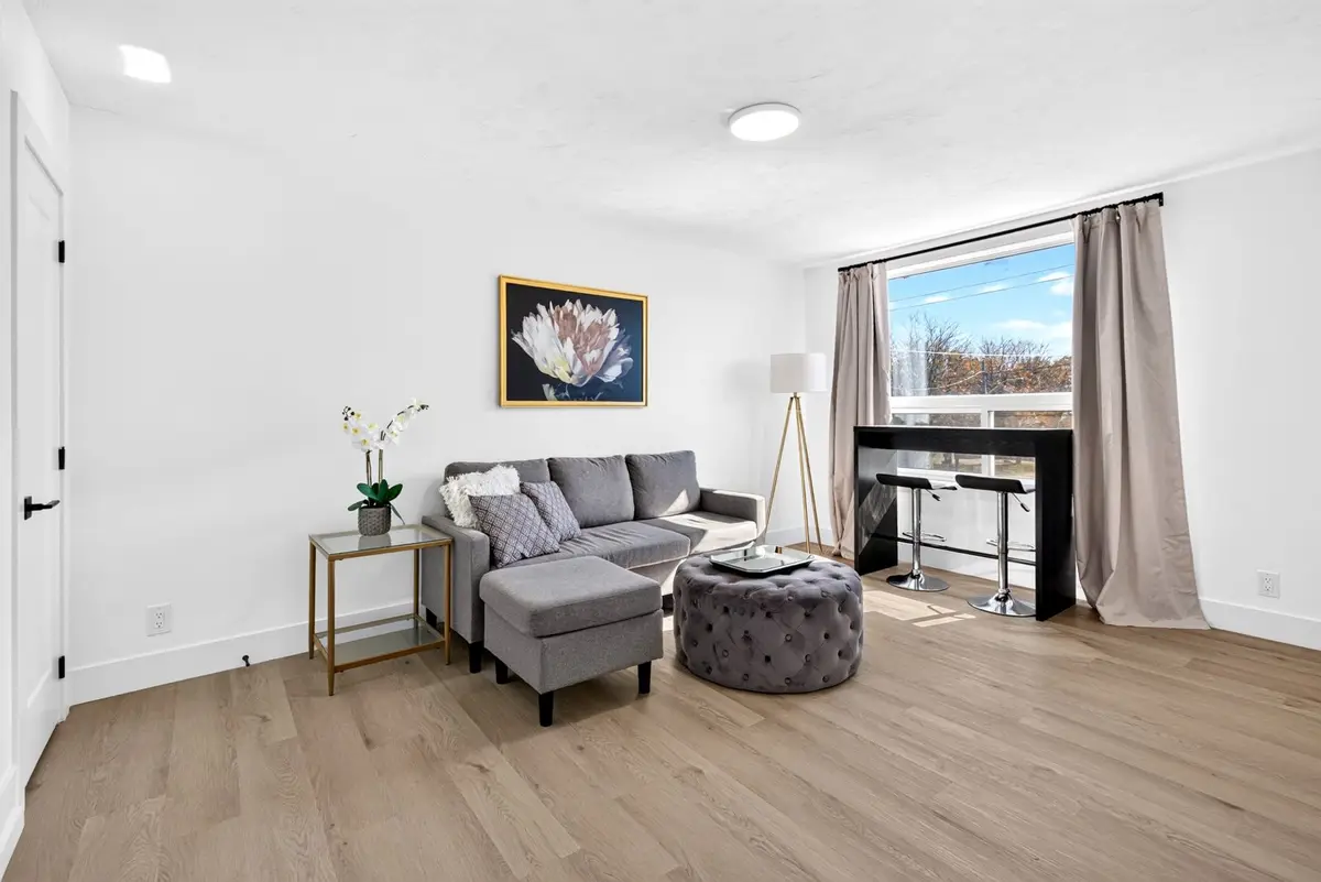 Furnished living room at McEwan Suites